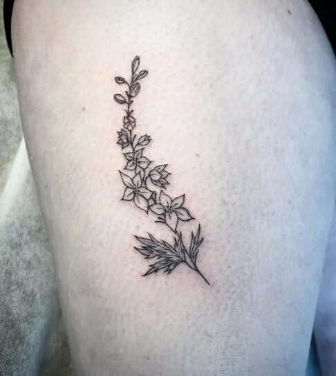 Lean line with July birth bloom tattoo